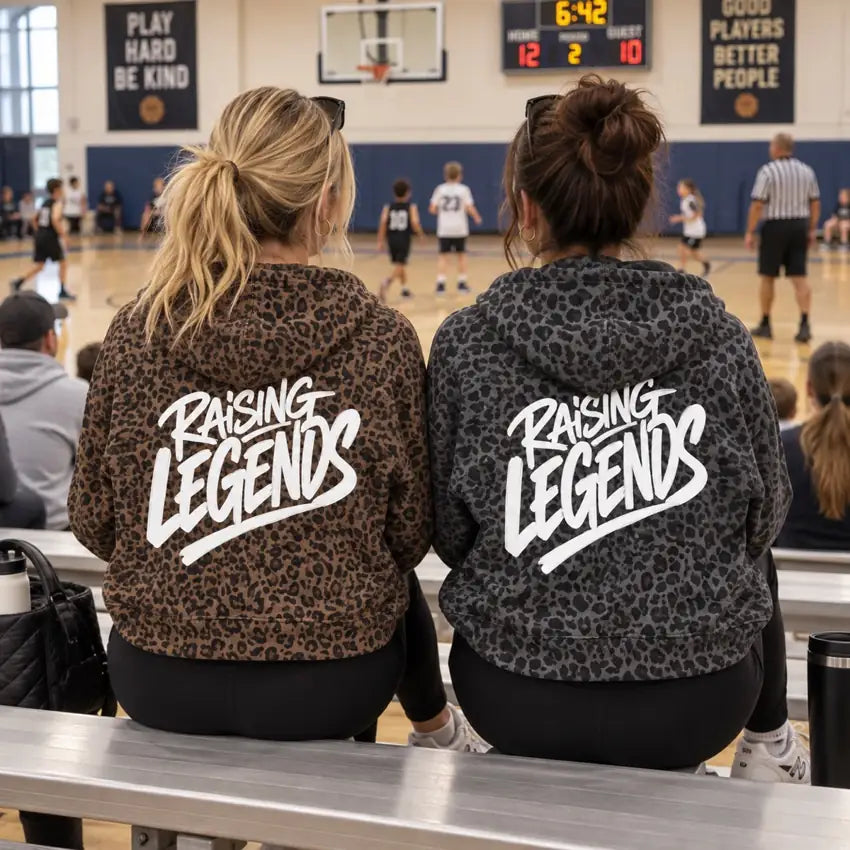 Sideline supporters wearing Raising Legends leopard hoodies